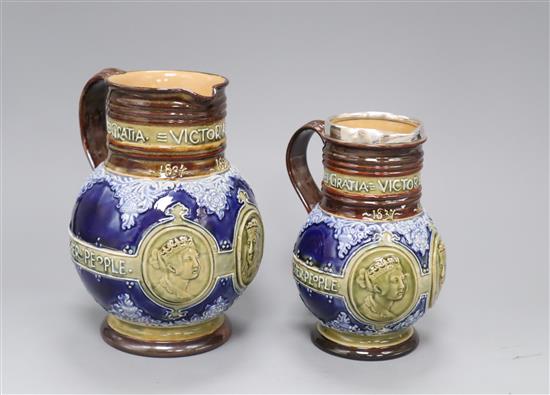 Two Doulton Lambeth graduated Queen Victoria Diamond Jubilee commemorative jugs, c.1896/7, H. 18.5 and 16cm